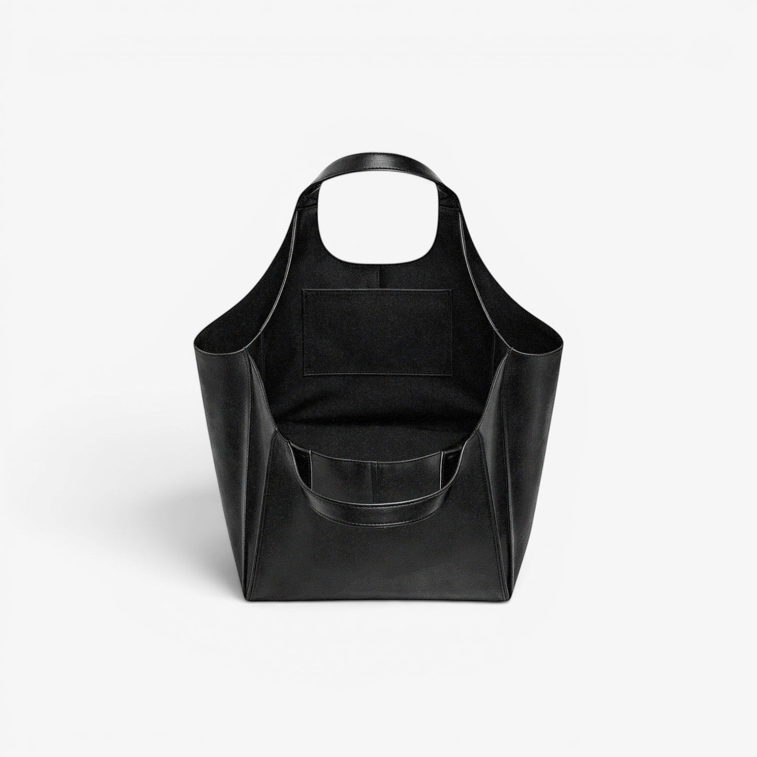 VAGOSHOPS Olga black vegan leather oversized tote bag with dual carry handles and interior pockets.